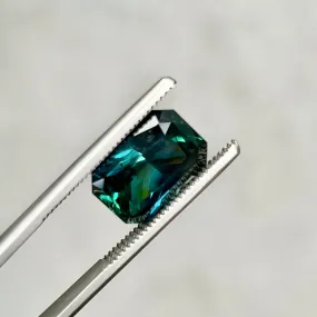 6.60CT RADIANT CUT MADAGASCAR SAPPHIRE, DEEP GREEN TEAL WITH FLASHES OF ROYAL BLUE , 12.70X8.55X6.16MM