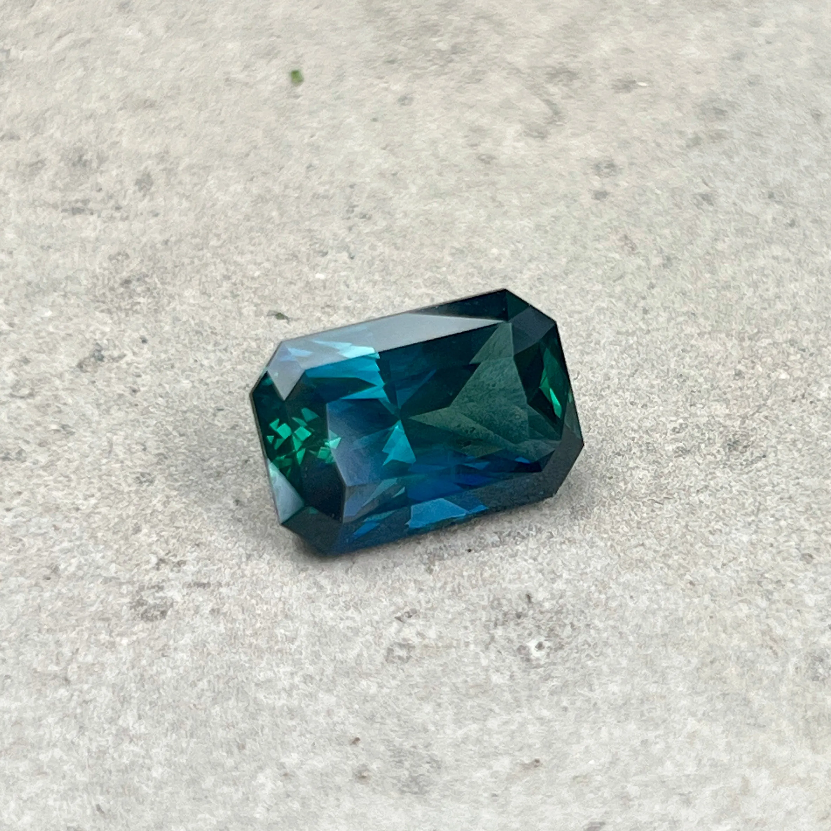 6.60CT RADIANT CUT MADAGASCAR SAPPHIRE, DEEP GREEN TEAL WITH FLASHES OF ROYAL BLUE , 12.70X8.55X6.16MM