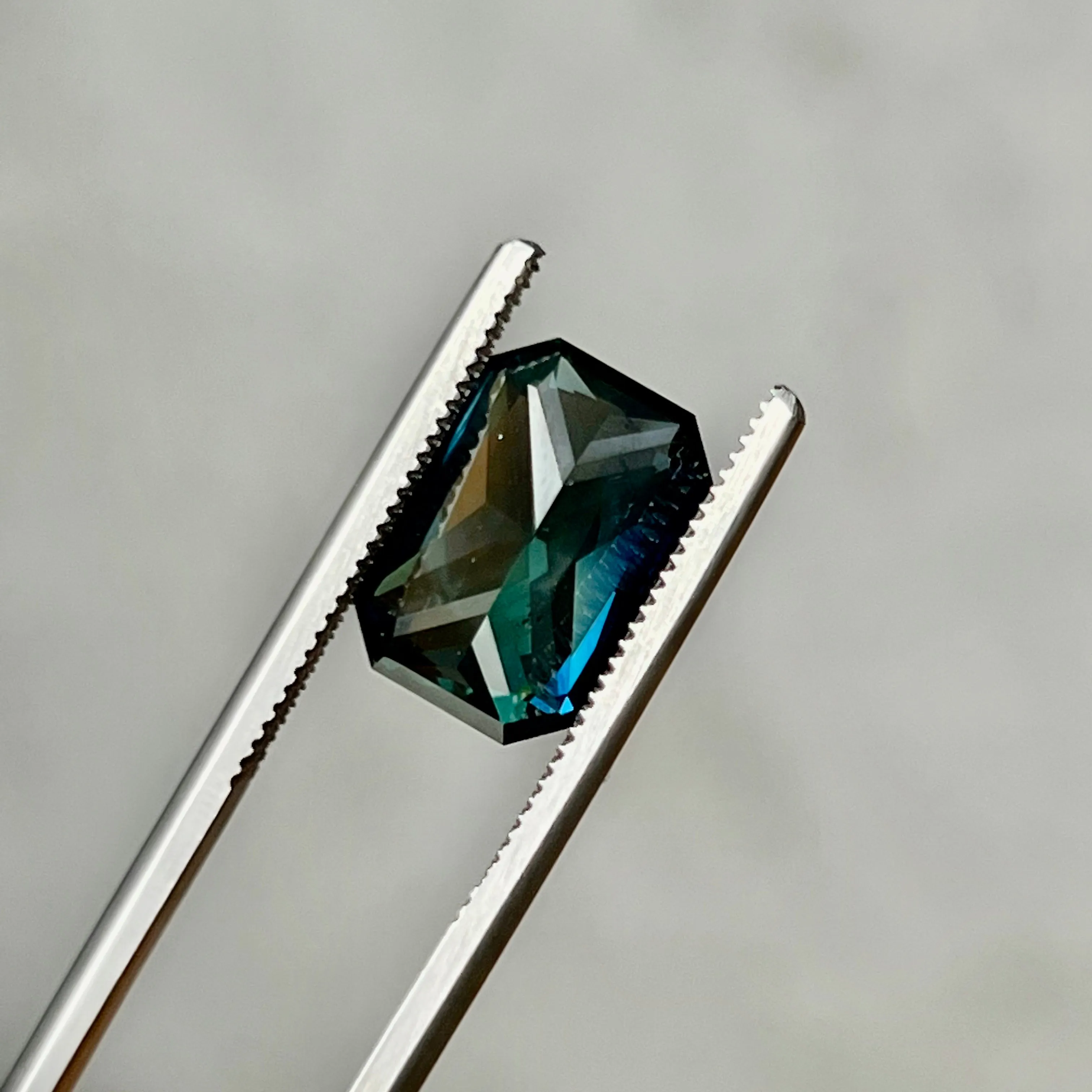 6.60CT RADIANT CUT MADAGASCAR SAPPHIRE, DEEP GREEN TEAL WITH FLASHES OF ROYAL BLUE , 12.70X8.55X6.16MM